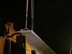 TU steel cable holding concrete bridge girder on crane hook Stock Footage