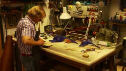 the shoemaker repairs a shoe Stock Footage