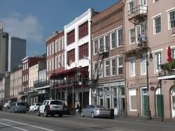 New Orleans skyline from Decatur street traffic Stock Footage