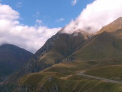 WS View of cloud flowing on mountains / Kazbegi, Georgia Stock Footage