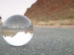 MS CU Crystal ball with inverted asphalt road / Tucson, Arizona, United States Stock Footage