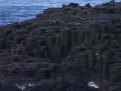 Giant's Causeway, pan from sea to rocks, Northern Ireland Stock Footage