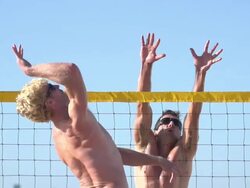 Men playing beach volleyball. - Slow Motion - filmed at 240 fps Stock Footage