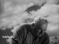1950: DORDOGNE VALLEY:  VS Farmer tending to vineyard, male hoeing w/ hoe, farmers ploughing w/ oxen, Fenelon Castle BG. Aquitaine Region, France, countryside, rural, agriculture, wine, Chateau Fenelon Instructional Video