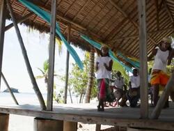 Static shot of girls dancing on stage as guy pay the bongo drums. Stock Footage