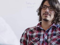 MS TU PAN young businessman sitting in discussion at workstation in high tech office Stock Footage