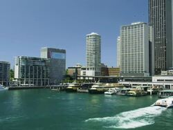 Ferry Boats at the Ferry Terminal of Circular Quay with the CBD Skyline, Sydney, New South Wales, Australia Stock Footage