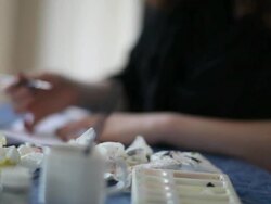 Girl painting and mixing colors. Stock Footage