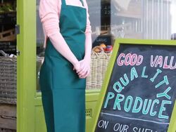 Portrait of shop owners outside grocery store Stock Footage