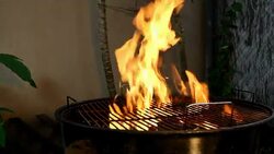Charcoal fire on a BBQ grill Stock Footage