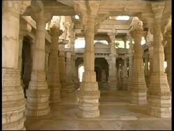 MS pan right through ornate interior of Jain temple in Rankpur, Rajasthan, India Stock Footage