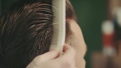 Barber using hair grease Stock Footage
