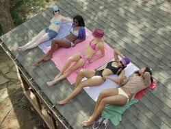 Women tanning on roof Stock Footage