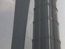 Tilt up Shanghai's famous skyscrapers the Jin Mao Tower and Shanghai World Financial Centre SWFC, China Stock Footage