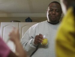 MS Dad chatting and drinking  juice with children at breakfast / Dallas, Texas, USA Stock Footage