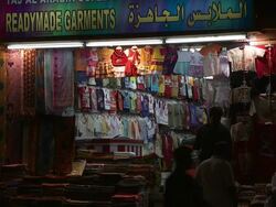 MS view of Garments shop with Children's clothes hanging on walls / Muscat, Oman Stock Footage