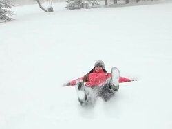 WS ZI Girl playing with snow during snowstorm / Yarmouth, Maine, USA Stock Footage