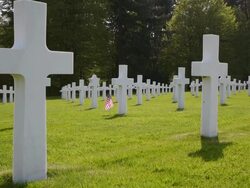 WS View of American war cemetery site and country flag / Sandweiler, Luxembourg Stock Footage