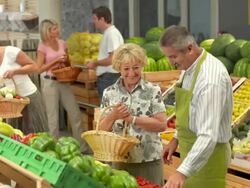 HD: People Shopping In Greengrocer'S Shop Stock Footage