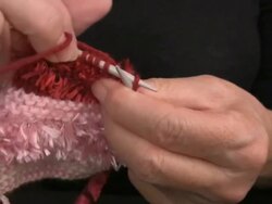 Closeup of Woman's Hands Knitting Purl Stitch with Pink Wools Stock Footage
