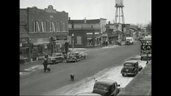 Lindstrom, Minnesota townspeople sweeping the streets Stock Footage