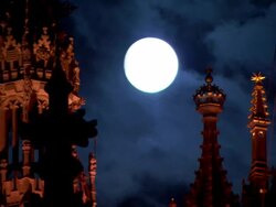 Medium Long Shot static - A full moon illuminates intricate Gothic spires in London. / London, UK Stock Footage