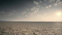 Dry, cracked earth and clouds Stock Footage
