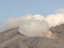 Steam rises from volcanic crater at dawn, Japan Stock Footage