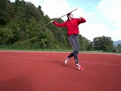 HD: Super Slo-Mo Shot of Young Woman Throwing Javelin Stock Footage