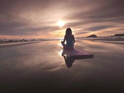 WS POV ZO Woman meditating on beach / Bandon, OR, United States  Stock Footage