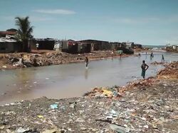 WS View of local people and local life with Sewer / Freetown, Sierra Leone Stock Footage