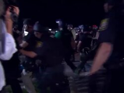 Clashes between protesters and police continue in Ferguson News Clip