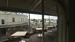 A hotel bar features an outdoor patio. Stock Footage