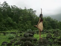 Young woman practicing yoga in the forest, Malshej Ghat, Maharashtra, India Stock Footage