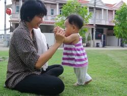Mother and baby first steps Stock Footage