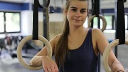 Smiling woman with gymnastics rings in gym Stock Footage