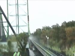 Multiple pan-left tilt-down tilt-up - A train rides a steep roller coaster / Jackson, New Jersey Stock Footage