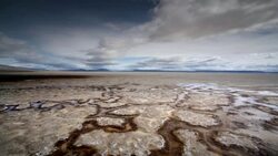 Dry, cracked earth and clouds Stock Footage