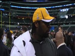 The latest NFL accessory is the power band, a slim rubber wrist band with holograms the size of small watch faces on either side. AP sports columnist Jim Litke went straight to the players at the Super Bowl to get to the bottom of this new trend Instructional Video