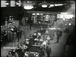 1947: GREYHOUND TERMINAL: WS 'Greyhound' building, bus pulling up. HA INT Travelers, commuters in terminal. VS People buying tickets at booth, waiting on line, boarding bus. CU Sign 'Philadelphia' changing to 'Washington.' CU Woman boarding, driver. Instructional Video