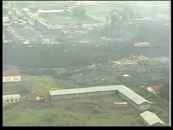 Aerials of lava flowing  through city and into Lake Kivu News Clip