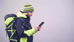 bearded hiker looking map on the tablet pc Stock Footage