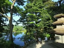 MS PAN View of Pagoda and Kasumigaike in Japanese garden Kenrokuen / Kanazawa, Ishikawa, Japan Stock Footage