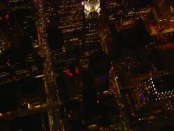 Aerial -At night, a vertical looking pass directly over the Chrysler building in mid-town Manhattan. Stock Footage
