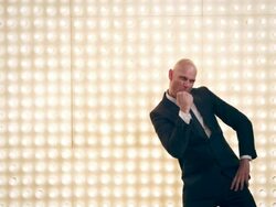 Man presenting in front of lightwall Stock Footage