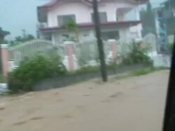 POV car driving through heavy flood waters flowing through town, Laoag, Philippines, typhoon Parma 4th October 2009 Stock Footage