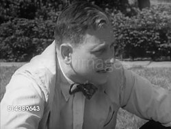 1953: YALE UNIVERSITY: POLITICAL SCIENCE CLASS: EXT VS Yale University students sitting in a circle outdoors on field for small informal class, political science professor Dolls talking (SOT) about political parties & systems, student commenting. Instructional Video