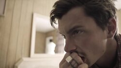 Young man seethes on motel bed as young woman paces back and forth behind him Stock Footage