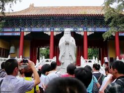 MS tourists visit statue of confucius at confucian temple / Beijing, China Stock Footage