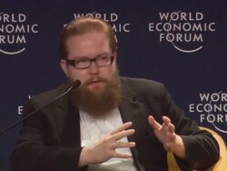MS Man with red beard speaking at World Economic Forum AUDIO / Davos, Graubunden, Switzerland Stock Footage